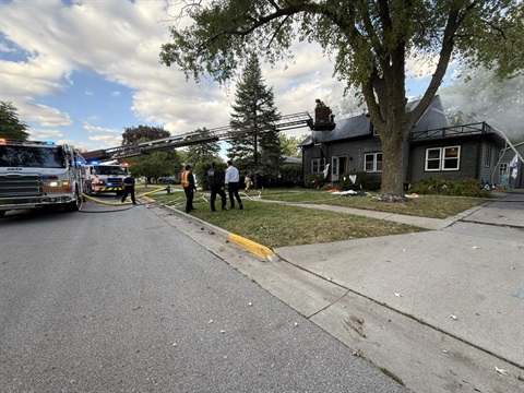 Fire fighters putting out a residential fire