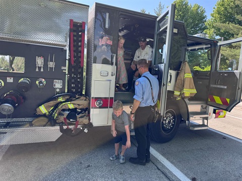 Kids playing on an Ames fire truck