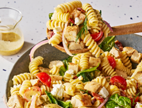 Bowl of pasta salad with chicken and vegetables