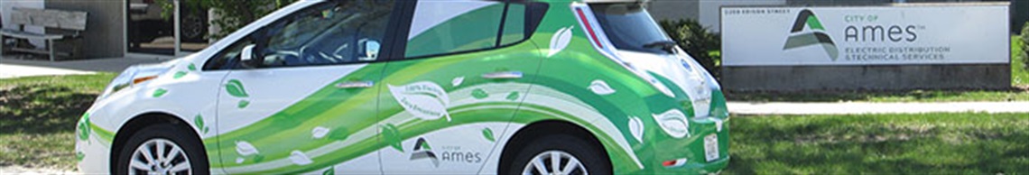 Electric car parked in front of City facility