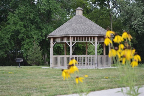 A white gazebo in a park