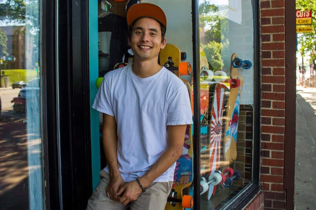 Georgie in front of his skateshop