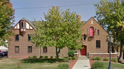 Brown house with tree