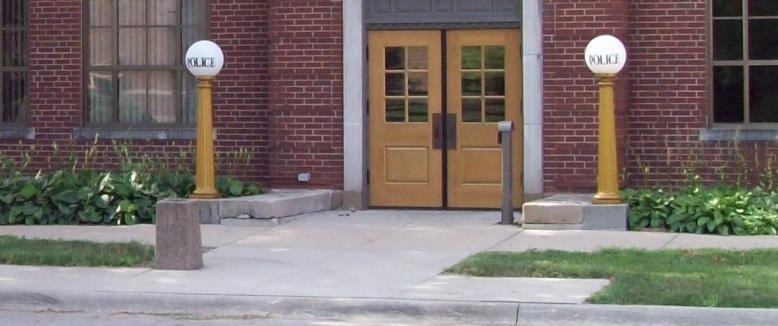 Police entrance with lamp posts.jpg