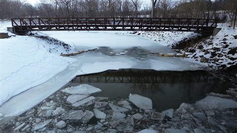 creek and pedestrian bridge