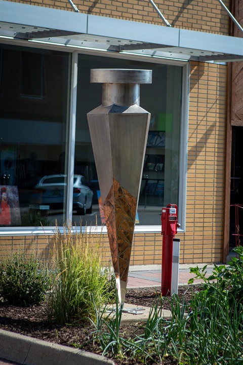 Metal nail sculpture with contrasting materials